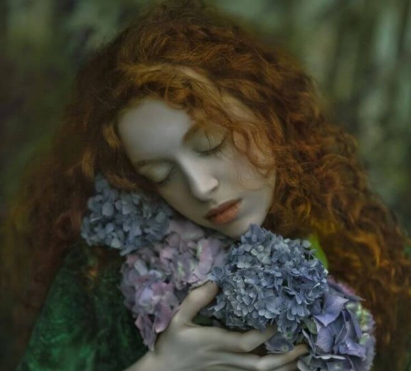 redhead-embracing-gray-flowers