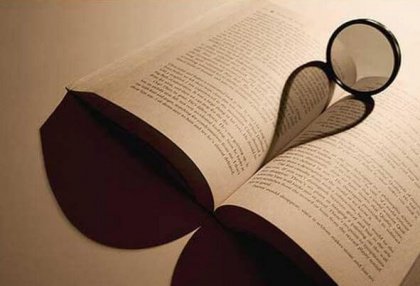 Open book with shadow of a heart