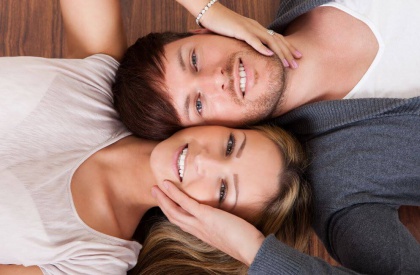 man and woman lying side by side