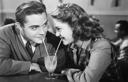 couple sharing a milkshake