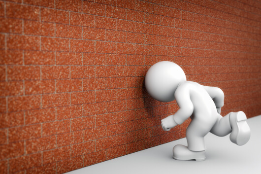 against the wall