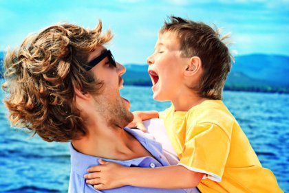 father and son laughing