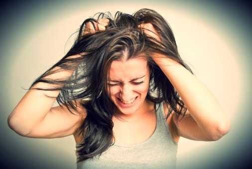 woman pulling out her hair