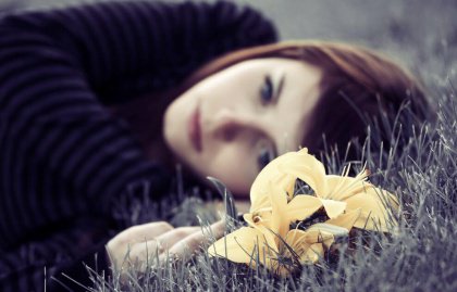 girl laying in grass