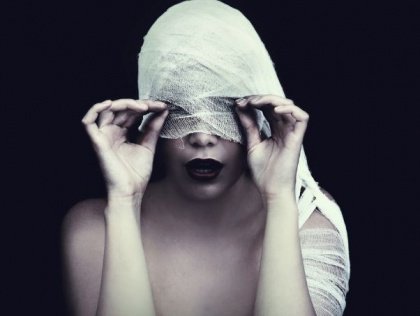 girls eyes covered with fabric