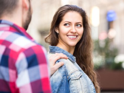 man making woman smile