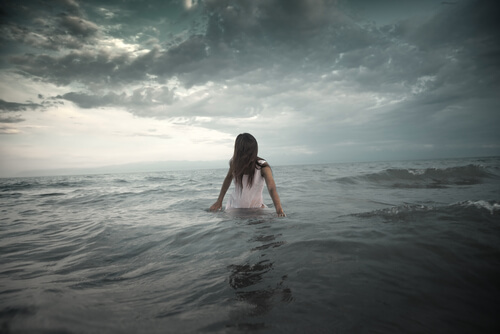 Girl Wading into Waves