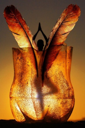 yoga pose with feathers