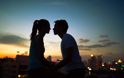 Two Silhouettes about to Kiss