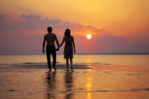 couple on the beach spending time together