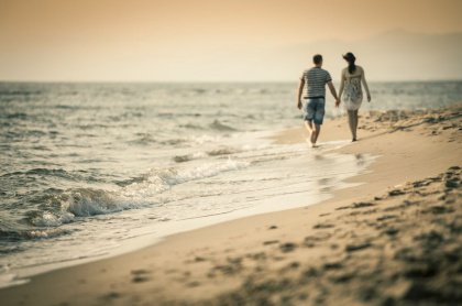 couple walking on the shore