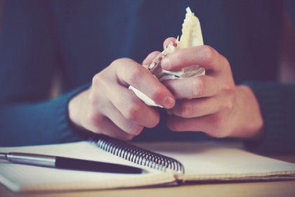 Hands Crumpling Paper