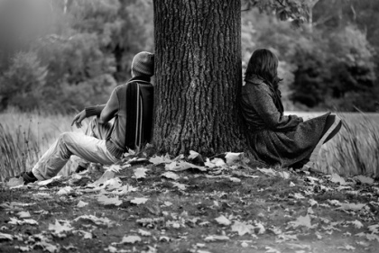 sitting by a tree