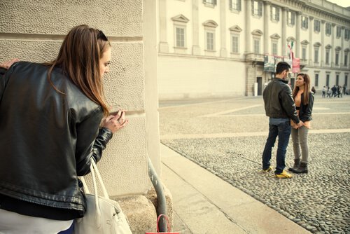 girl spying on couple jealous