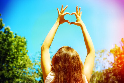 woman with hands as heart