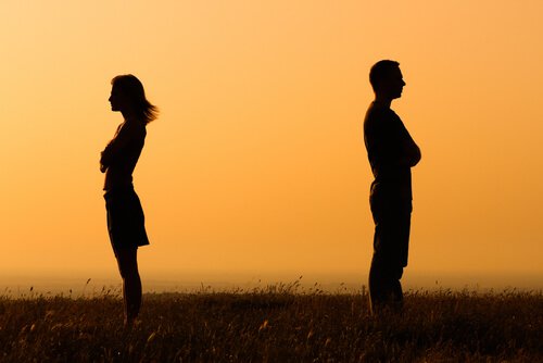 couple with their backs to each other distance