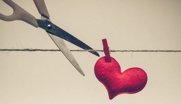 scissors cutting line with heart toxic