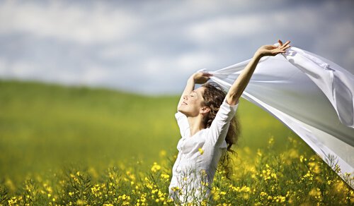 woman dressed in white and happy