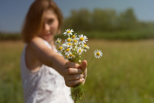 woman offering flowers