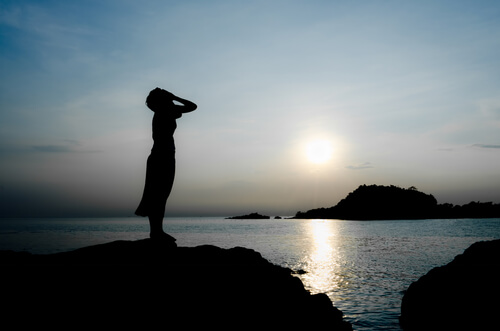 Woman Crying on Mountain