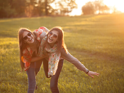 friends smiling in the field