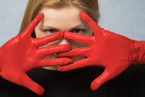woman wearing red gloves myth