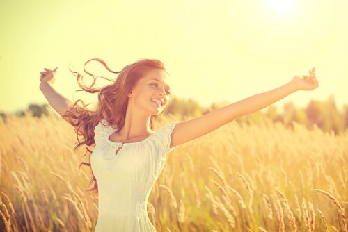 happy free woman in a field