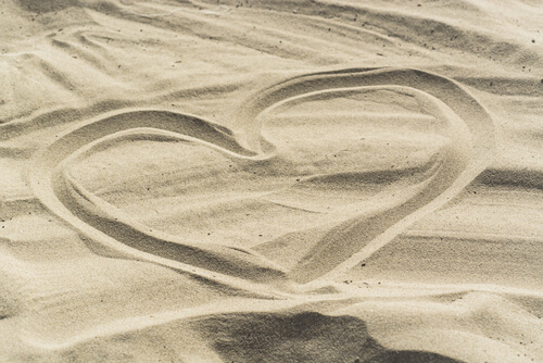heart drawn in the sand