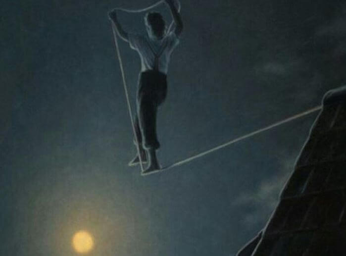 person balancing on string