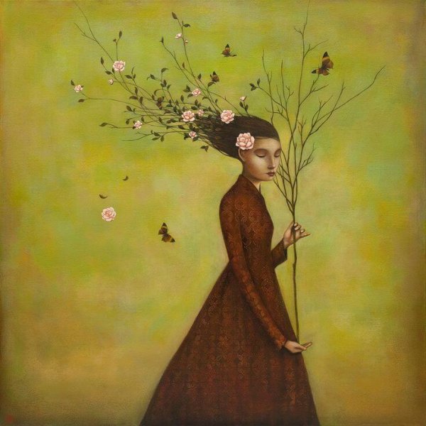woman holding a branch