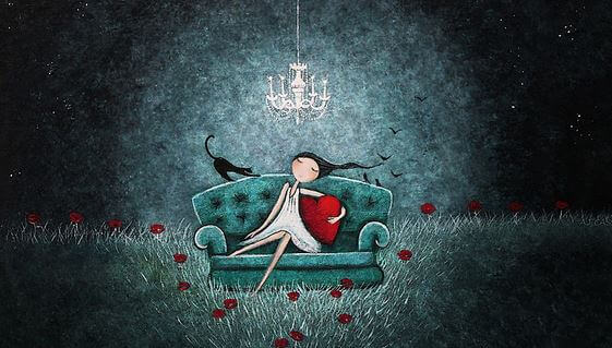 couch under a chandelier
