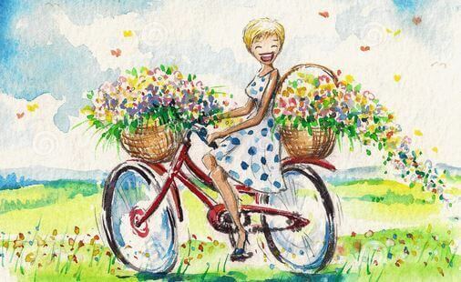 happy girl with flowers on bike
