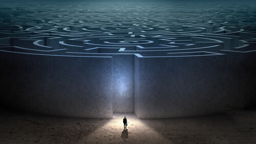 man entering maze confronting