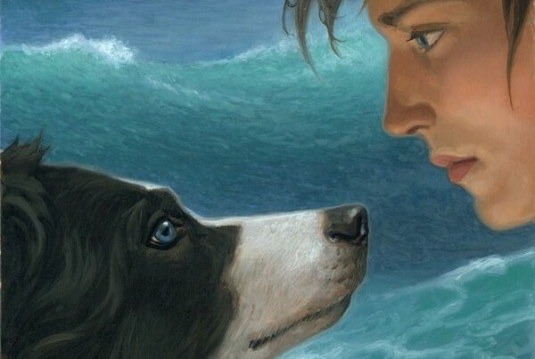 young man looking at his pet