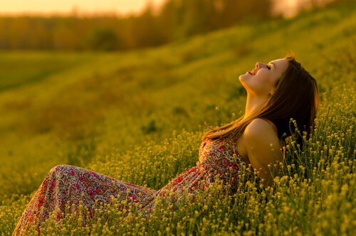 happy woman in meadow