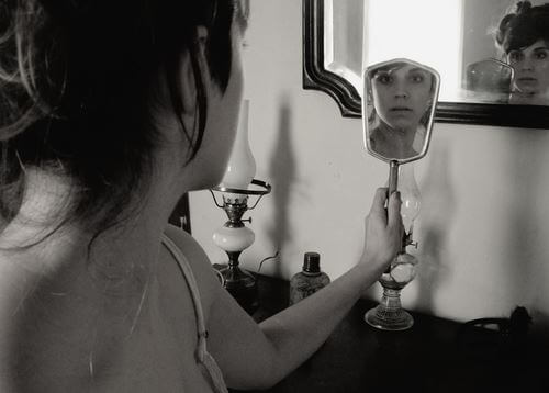 lady looking in a mirror