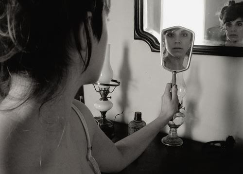 lady looking in a mirror