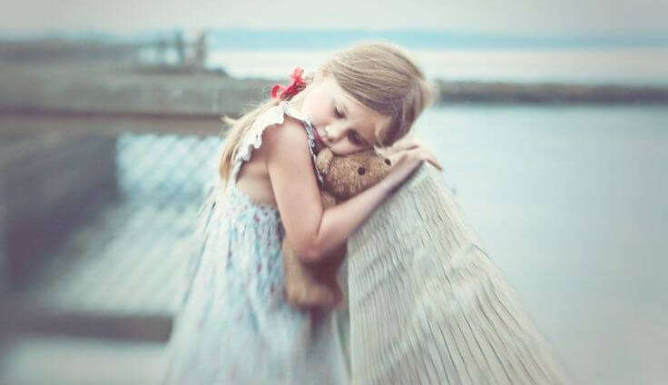Girl Hugging Teddy Bear