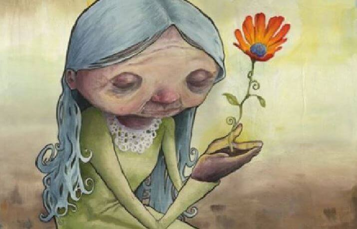 old woman holding flower