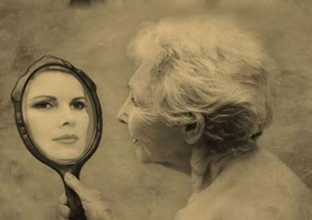 old woman looking in the mirror