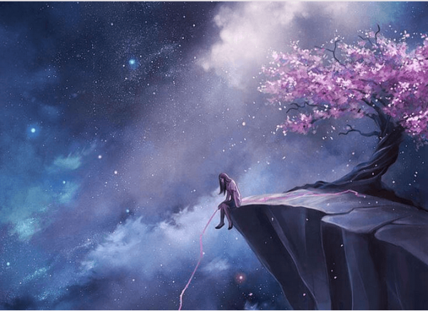 woman sitting on a cliff