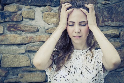 girl thinking with her hands on her head