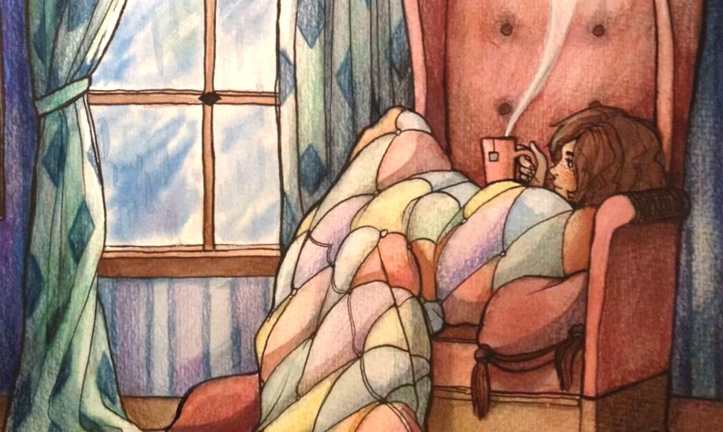 girl with a cup on a sofa