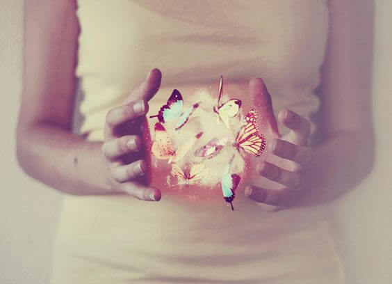 girl with butterflies in her hand