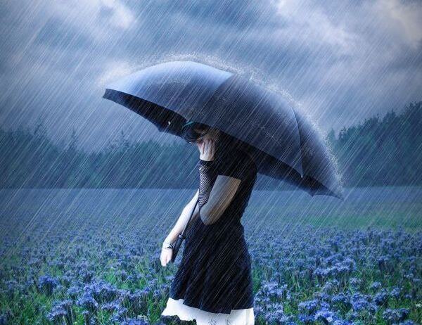 girl with umbrella thinking about being independent