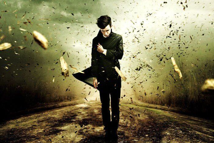 Man Walking Against Wind