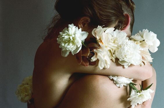 hugging couple with flowers