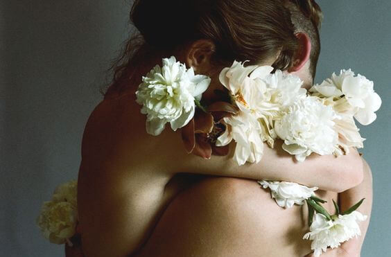 hugging couple with flowers