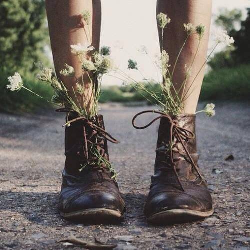 legs with boots filled with flowers