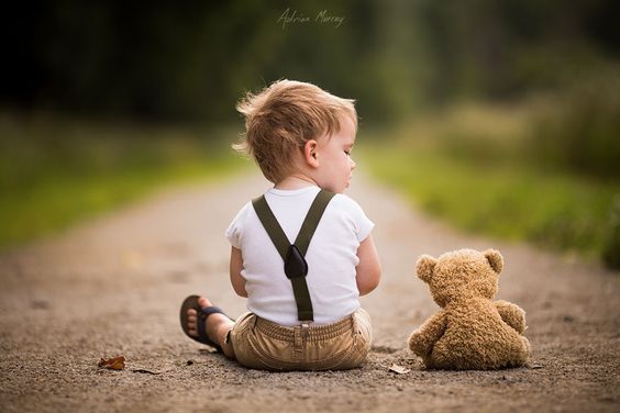 little boy and stuffed bear